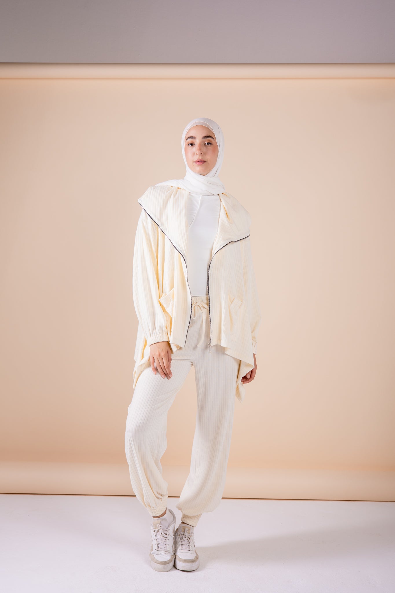 The asymmetrical set in offwhite