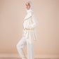 The asymmetrical set in offwhite