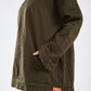 Girl in the hood in olive